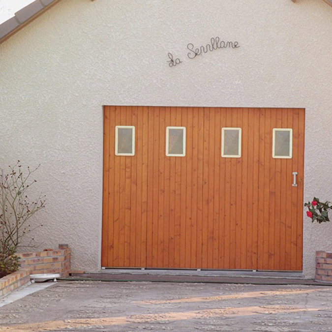 Porte de garage traditionnelle Janibel Bois